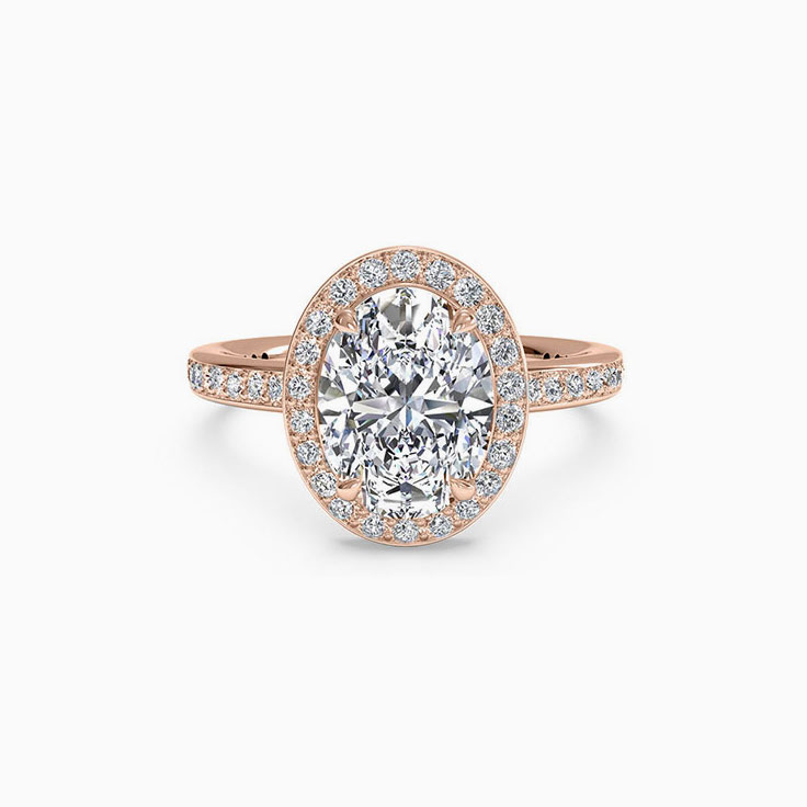 Oval Cut engagement ring with a daimond halo and diamond band