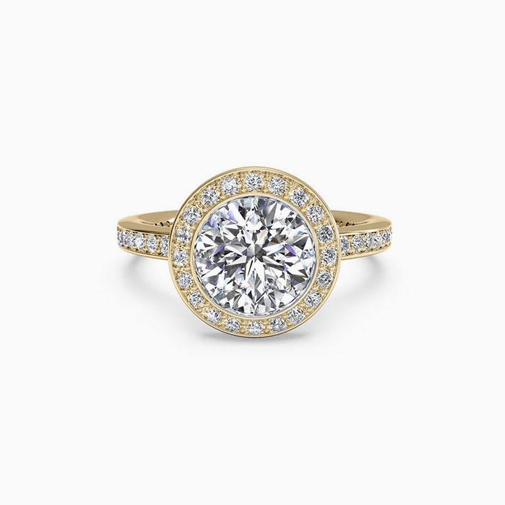 Round Brilliant cut diamond engagement ring with pave halo