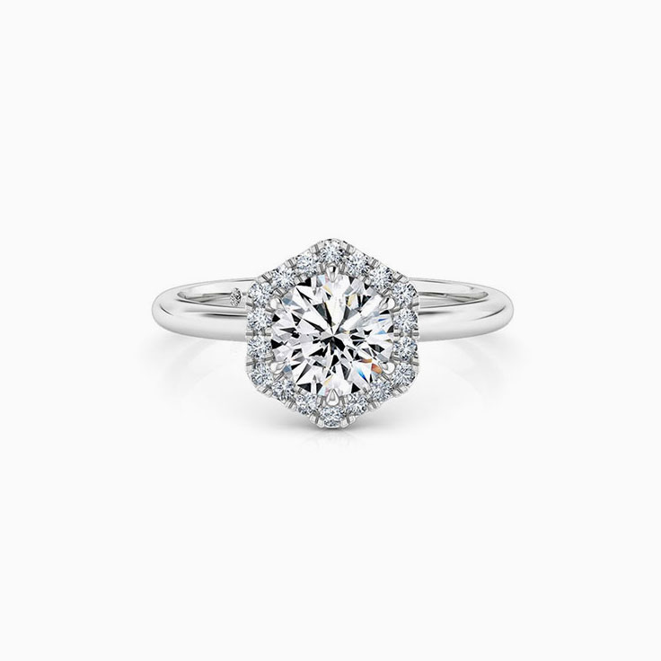 Round Brilliant cut diamond with a hexagon shape halo