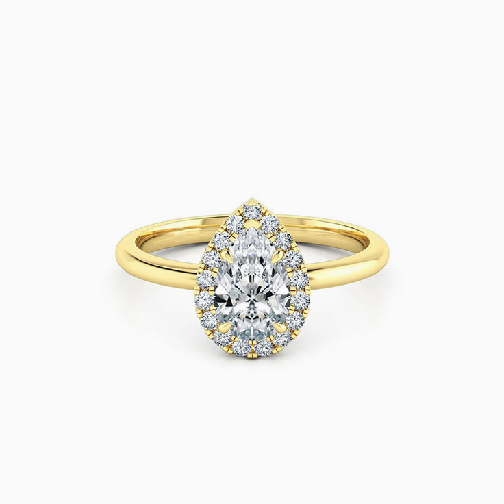 Pear diamond engagement ring with a diamond halo