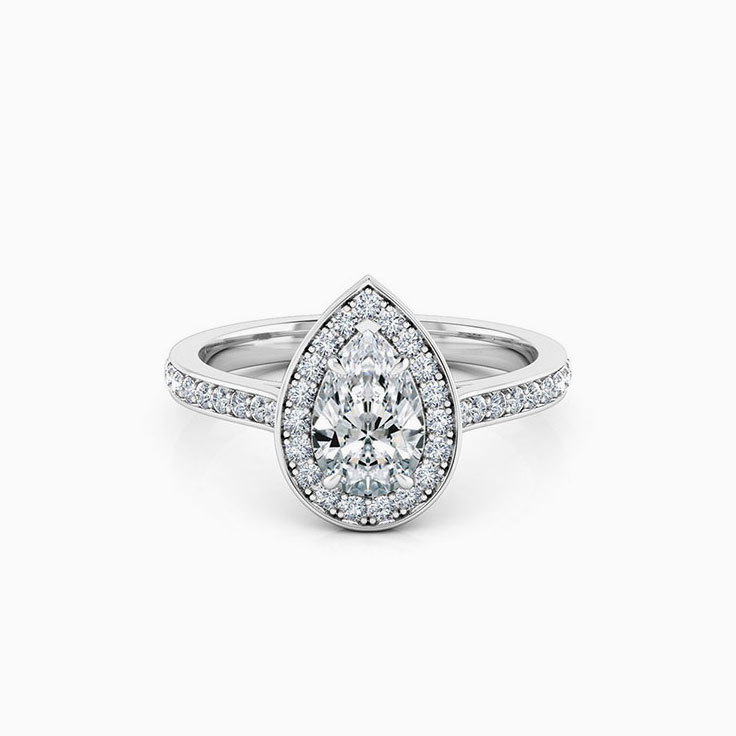 Pear cut diamond engagement ring with pave halo