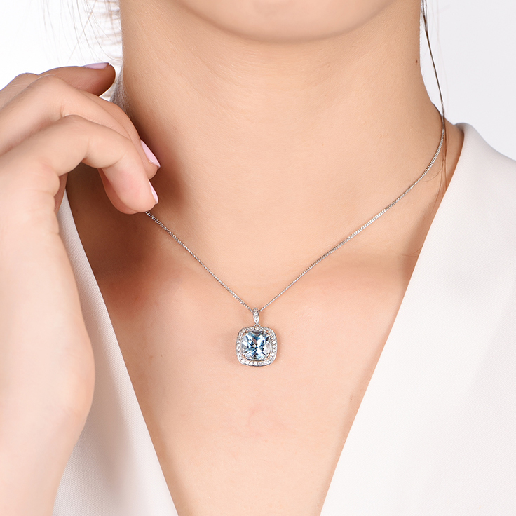 Blue Topaz and Diamond pendant