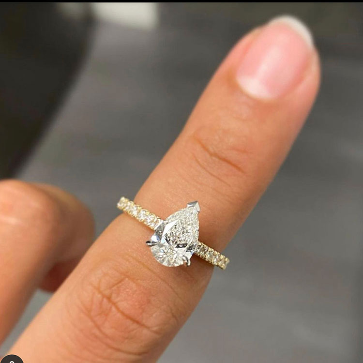 Pear cut diamond engagement ring set on a diamond band