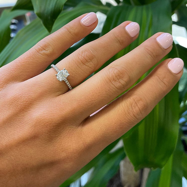 Oval cut diamond engagement ring set on a diamond band