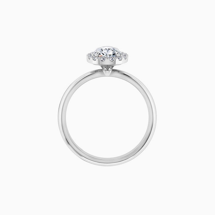 Pear diamond engagement ring with a diamond halo
